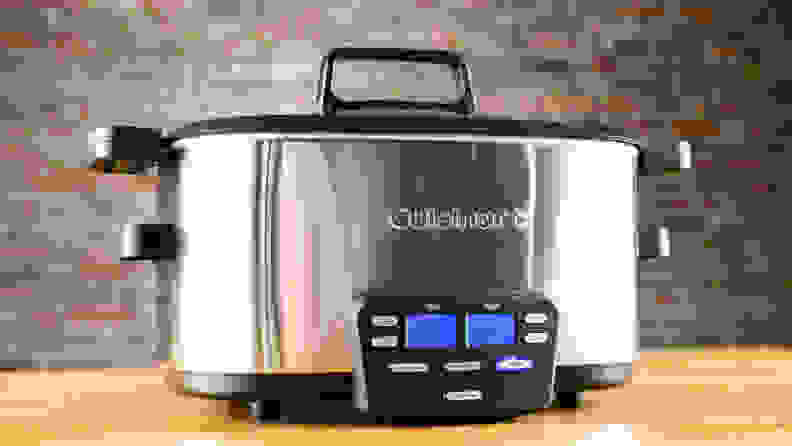 stainless steel crock pot on wooden table